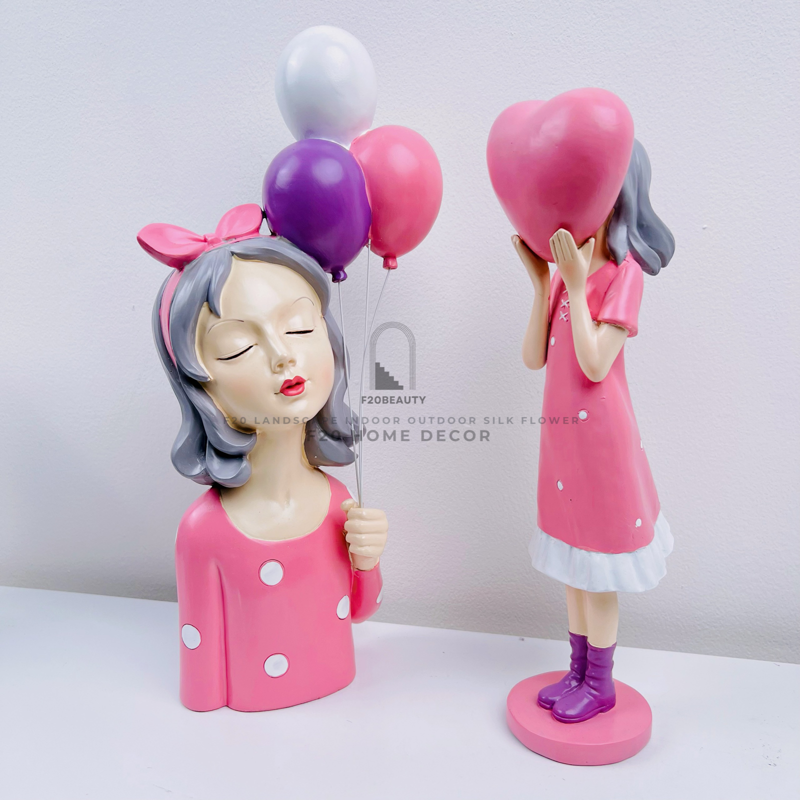 Tượng cô gái đáng yêu màu hồng