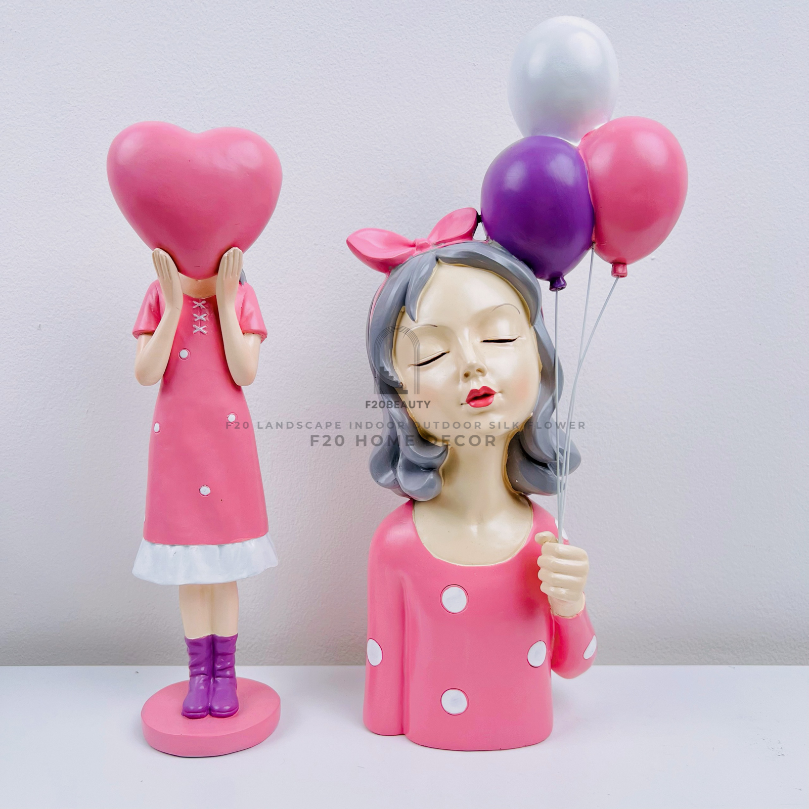 Tượng cô gái đáng yêu màu hồng